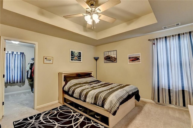 1211 Chapel Estates Way, Dacula, GA 30019 - carpeted bedroom with a raised ceiling and ceiling fan