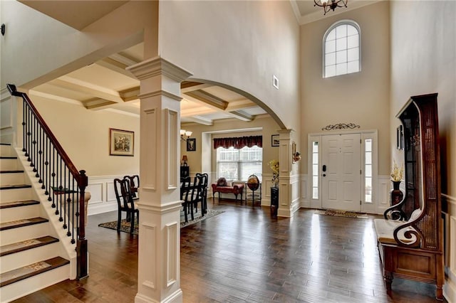 1211 Chapel Estates Way, Dacula, GA 30019 - entryway with ornate columns, arched walkways, a decorative wall, ornamental molding, and a chandelier