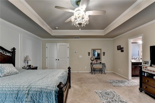 1211 Chapel Estates Way, Dacula, GA 30019 - bedroom featuring a raised ceiling, light carpet, ornamental molding, ceiling fan, and ensuite bath