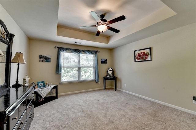 1211 Chapel Estates Way, Dacula, GA 30019 - living area with a ceiling fan, a raised ceiling, and light carpet