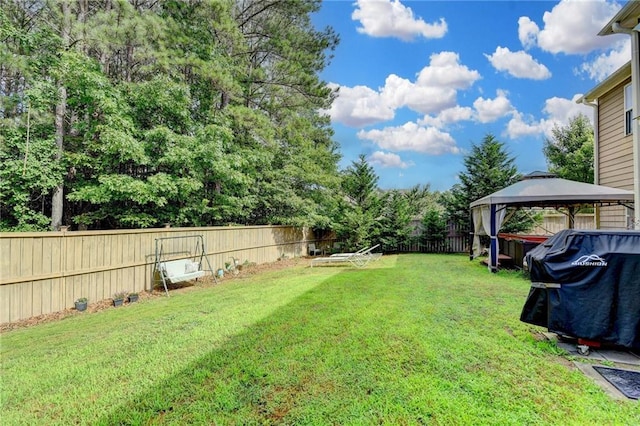 1211 Chapel Estates Way, Dacula, GA 30019 - fenced backyard featuring a gazebo