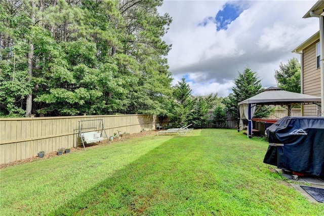 1211 Chapel Estates Way, Dacula, GA 30019 - fenced backyard featuring a gazebo