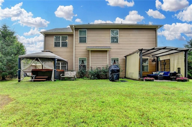1211 Chapel Estates Way, Dacula, GA 30019 - back of property featuring a hot tub, outdoor lounge area, a pergola, a gazebo, and a lawn