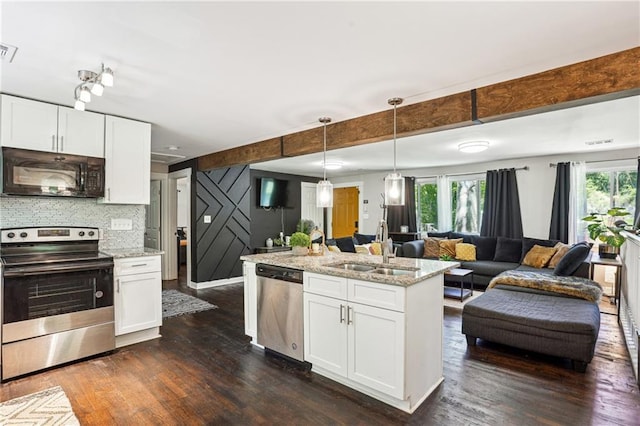 877 Lee Andrews Ave SE, Atlanta, GA 30315 - kitchen with a sink, dark wood-style flooring, appliances with stainless steel finishes, open floor plan, and white cabinetry