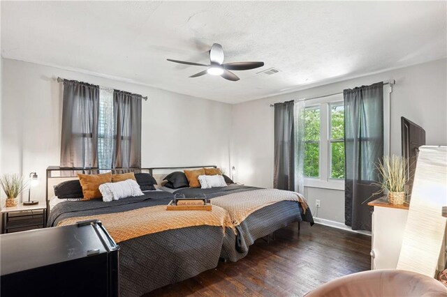 877 Lee Andrews Ave SE, Atlanta, GA 30315 - bedroom with wood finished floors, visible vents, baseboards, and ceiling fan