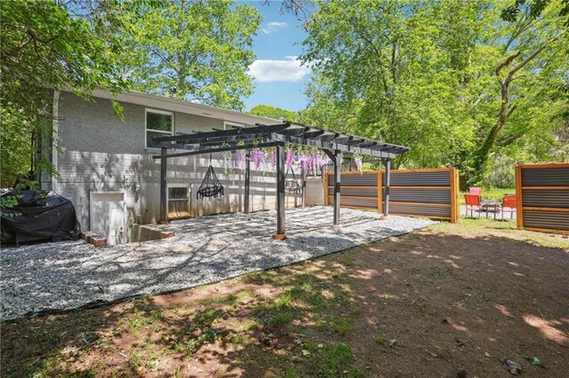 877 Lee Andrews Ave SE, Atlanta, GA 30315 - view of patio / terrace with fence, a pergola, and a grill