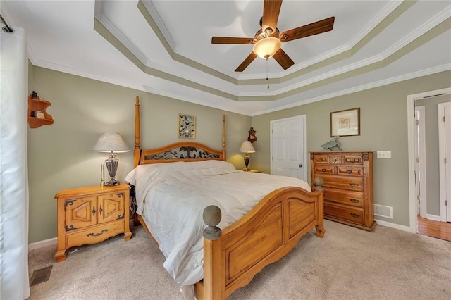 503 Silver Maple Ln, Woodstock, GA 30189 - bedroom featuring a tray ceiling, light carpet, ornamental molding, a ceiling fan, and baseboards