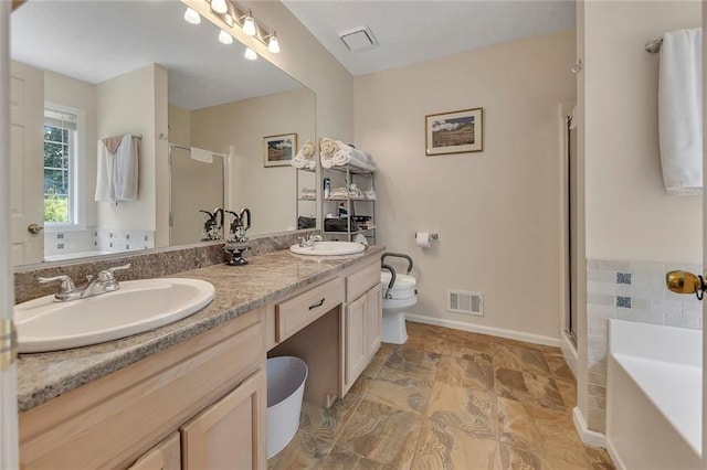 503 Silver Maple Ln, Woodstock, GA 30189 - full bathroom featuring double vanity, a shower stall, a bath, and toilet