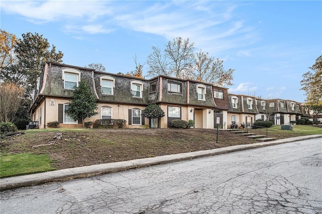 46 Le Parc Fontaine, Lithonia, GA 30038 - view of front of property featuring mansard roof, a residential view, stucco siding, and roof with shingles