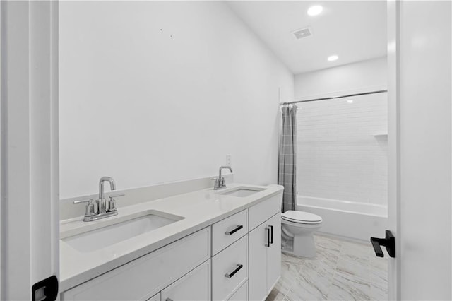 full bathroom featuring shower / bath combination with curtain, vanity, and toilet