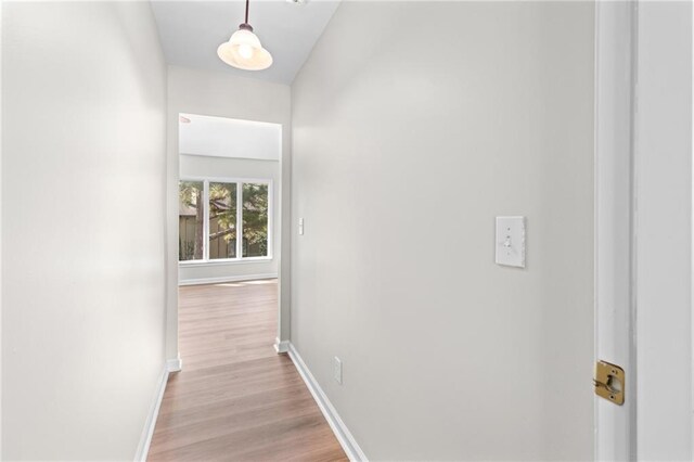 hall with light hardwood / wood-style flooring