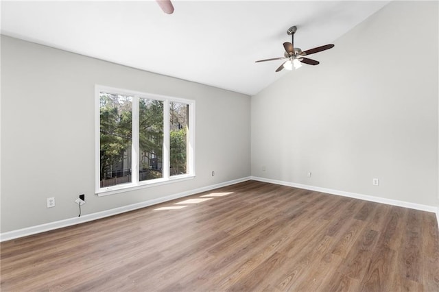 unfurnished room featuring wood-type flooring, ceiling fan, and lofted ceiling