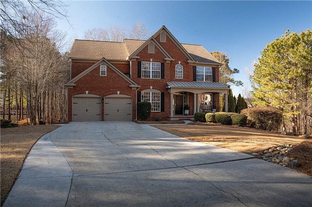 view of front of home with covered porch and a garage