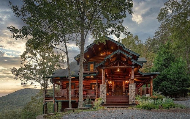 log-style house featuring a porch