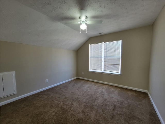 additional living space featuring lofted ceiling, carpet flooring, visible vents, and baseboards