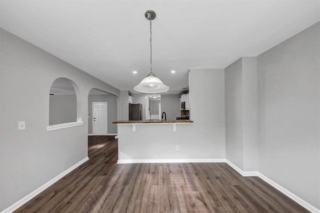 interior space with sink and dark hardwood / wood-style floors