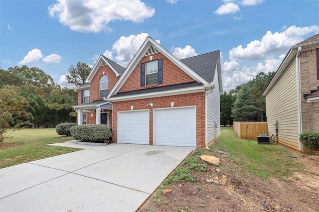 view of front of property featuring central AC unit, a garage, and a front lawn