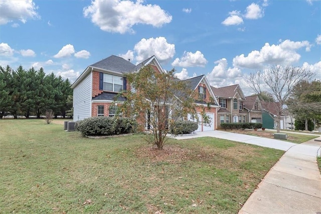 view of front of house with central AC unit, a front yard, and a garage