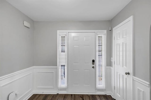 entryway with dark hardwood / wood-style floors