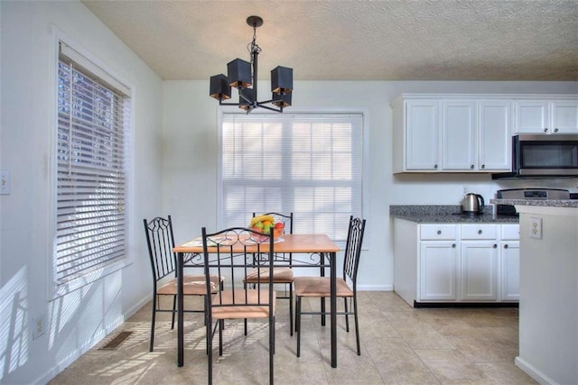 dining area featuring a chandelier