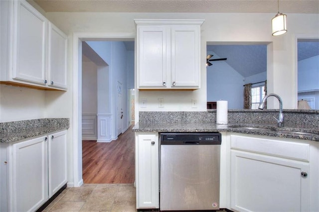 kitchen with stainless steel dishwasher and white cabinets