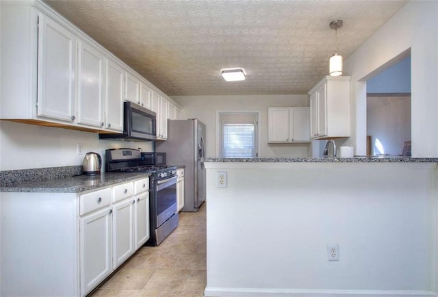 kitchen featuring pendant lighting, white cabinetry, kitchen peninsula, and appliances with stainless steel finishes