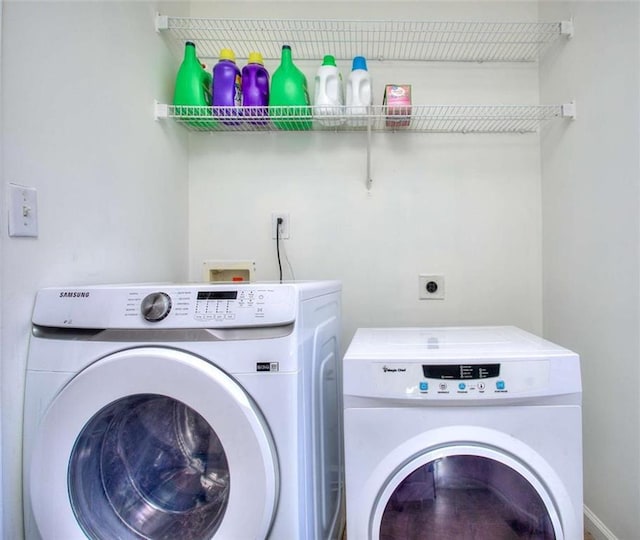 clothes washing area featuring washing machine and clothes dryer