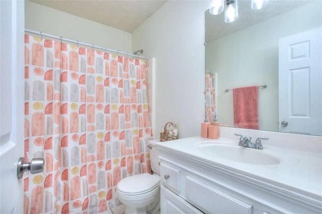 bathroom with a shower with shower curtain, vanity, toilet, and a textured ceiling