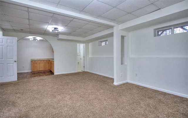 basement with carpet and a drop ceiling