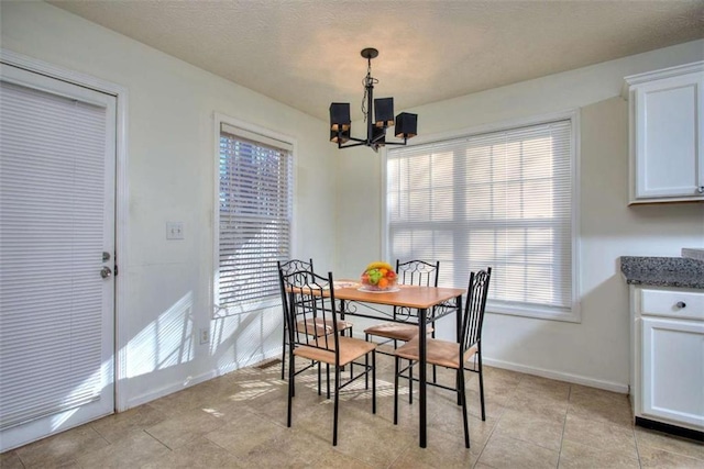 dining area featuring an inviting chandelier