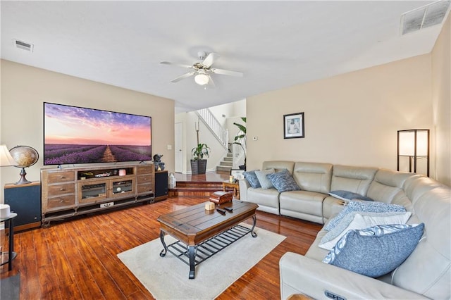 living room with ceiling fan and wood-type flooring