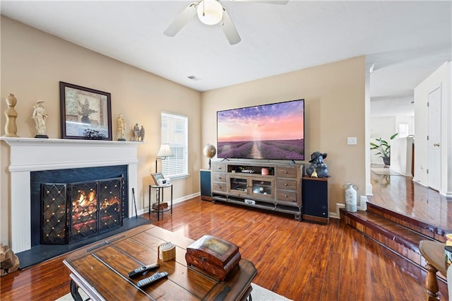 living room with hardwood / wood-style flooring and ceiling fan