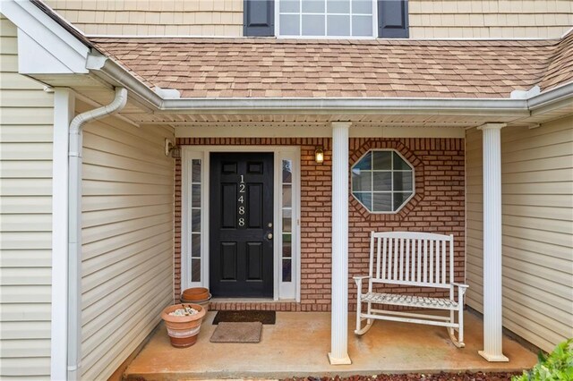 property entrance featuring covered porch