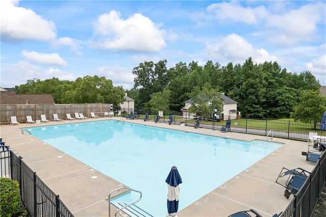 view of swimming pool with a patio