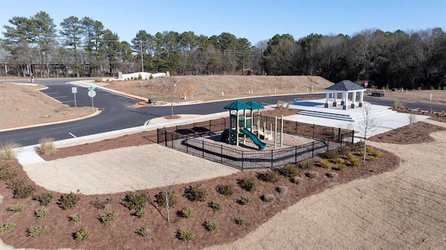 view of home's community with a playground and a gazebo