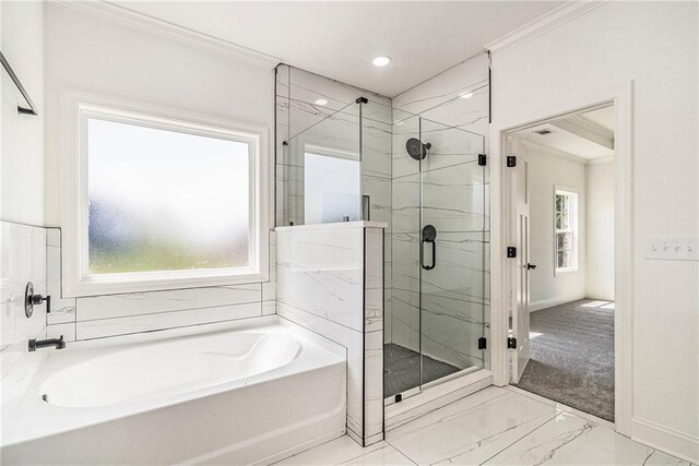 bathroom with shower with separate bathtub and crown molding