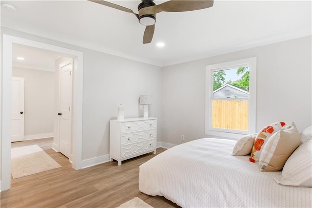 bedroom with recessed lighting, baseboards, a ceiling fan, light wood-type flooring, and ornamental molding
