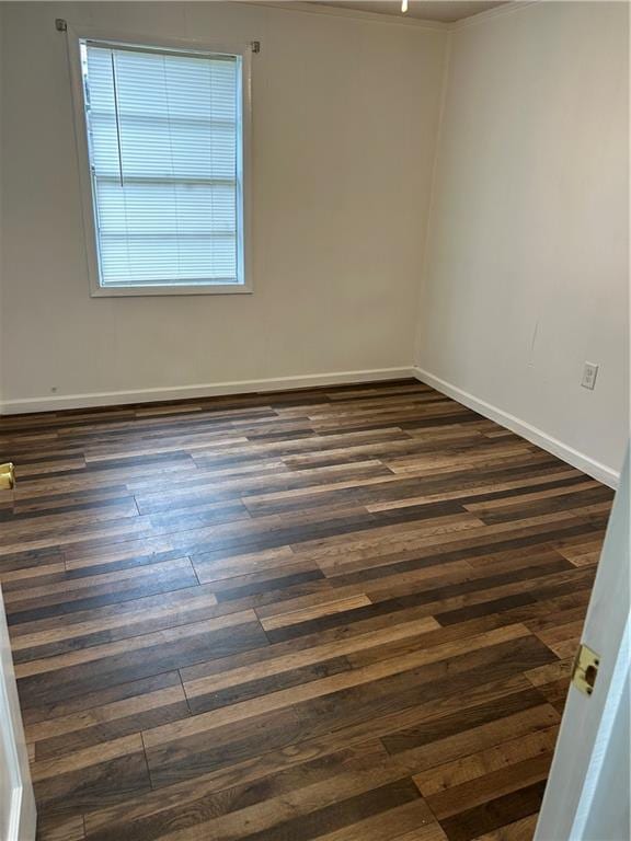 empty room with dark hardwood / wood-style floors