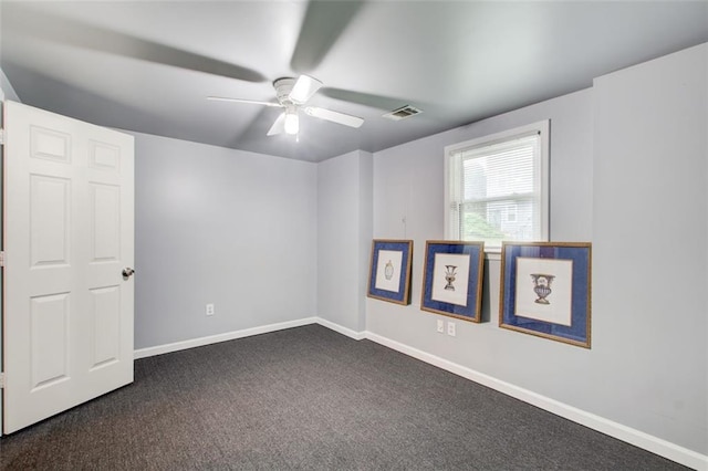 1360 Stampmill Way, Lawrenceville, GA 30043 - empty room featuring a ceiling fan, dark colored carpet, and baseboards