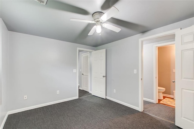 1360 Stampmill Way, Lawrenceville, GA 30043 - unfurnished bedroom with dark carpet, baseboards, and a ceiling fan