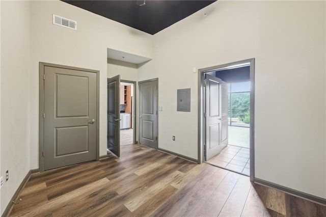 3400 Malone Dr Unit 303, Atlanta, GA 30341 - empty room with wood finished floors, electric panel, and baseboards