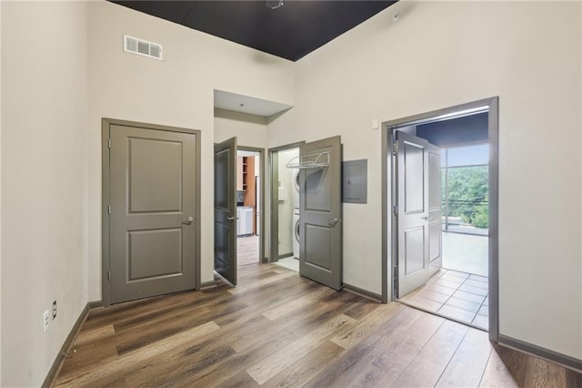 3400 Malone Dr Unit 303, Atlanta, GA 30341 - unfurnished bedroom with wood finished floors, electric panel, washer / clothes dryer, baseboards, and ensuite bathroom