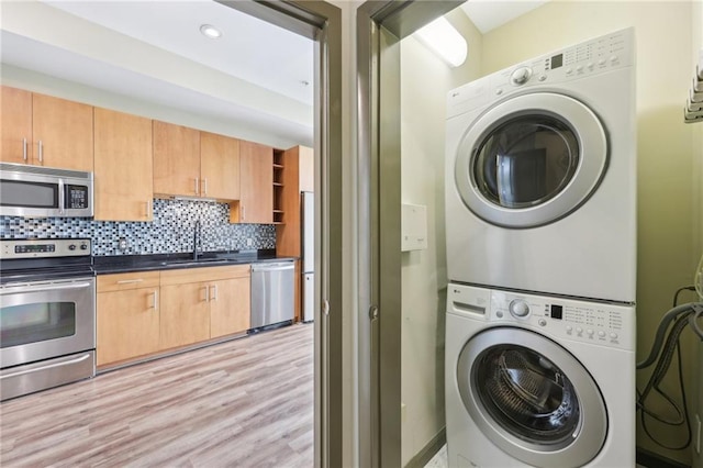 3400 Malone Dr Unit 303, Atlanta, GA 30341 - laundry area featuring stacked washer / drying machine, light wood finished floors, and recessed lighting