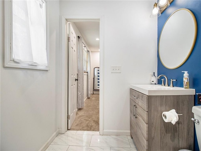 bathroom with vanity and toilet