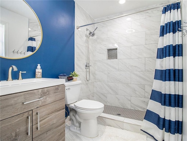 bathroom with toilet, vanity, and a shower with shower curtain