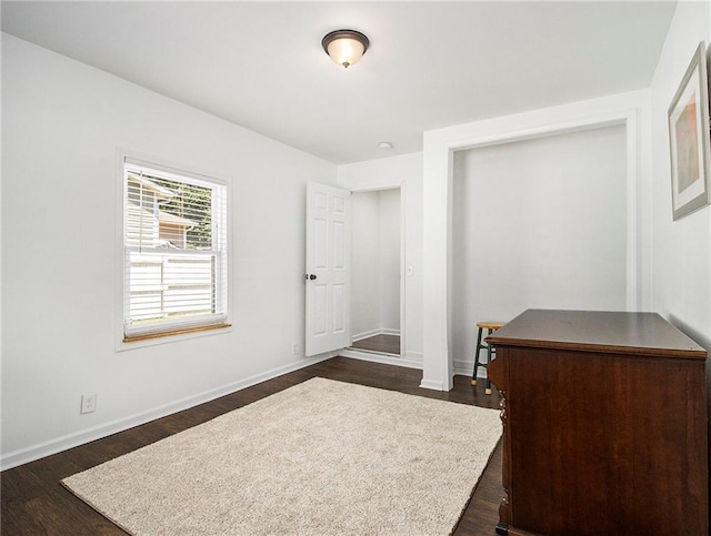 bedroom featuring dark hardwood / wood-style flooring