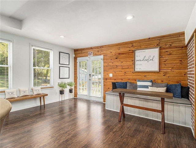 office space featuring wooden walls and dark hardwood / wood-style flooring