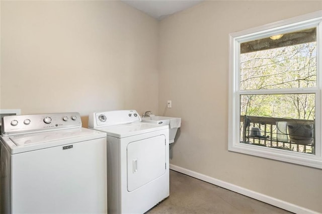 washroom featuring independent washer and dryer and sink