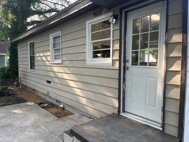 633 Tom Read Dr, Marietta, GA 30062 - property entrance with a patio and crawl space