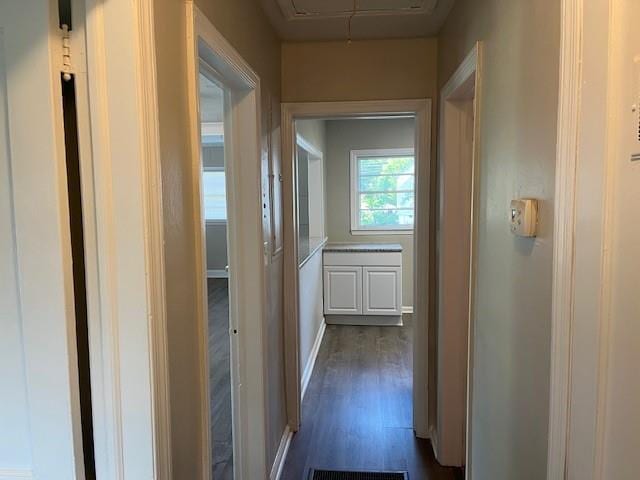 633 Tom Read Dr, Marietta, GA 30062 - hallway with attic access, dark wood finished floors, and baseboards